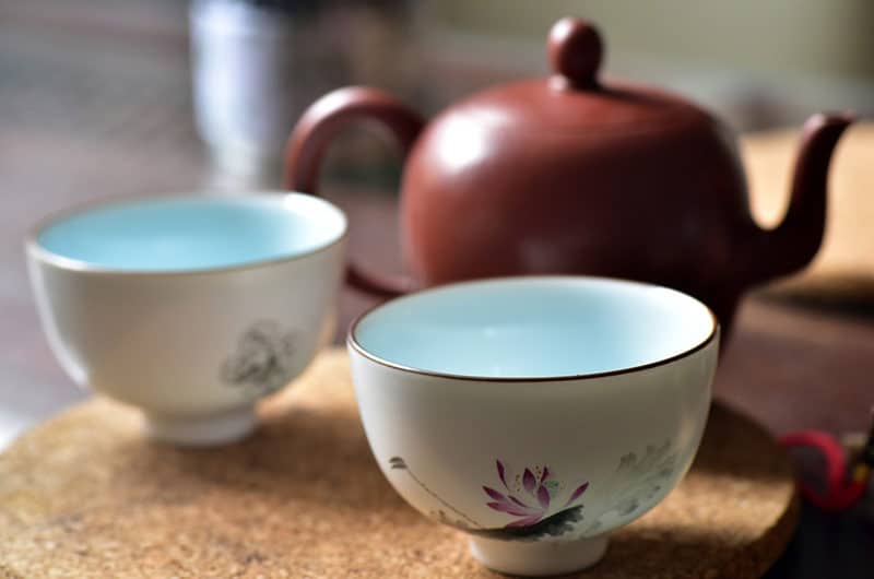 tea cups and pot offering a typical China travel experience
